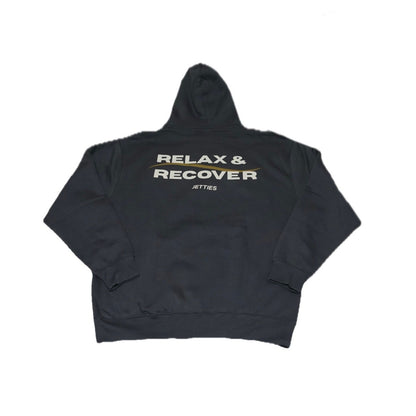 Back view of the gray Relax & Recover hoodie laid flat with large white and gold back print.